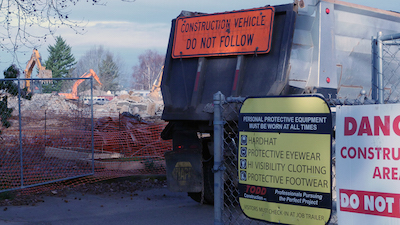  dump truck enters the job site. Photo by Carl Jameson