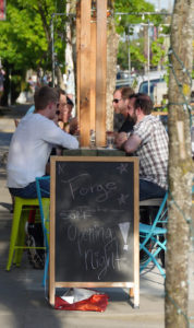 Customers enjoy the outdoor seating at Forge. Photo by Carl Jameson