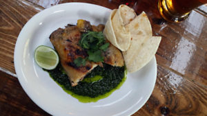 Chicken hind quarter with garlic cilantro mojo served at Forge, one of Alberta Street’s newest restaurants. Photo by Carl Jameson