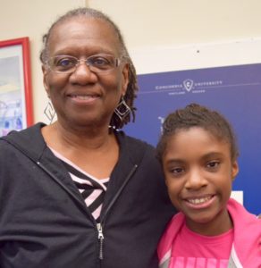 Jane Mayes, pictured here with her granddaughter, is a Ties that Bind navigator. Through the program Mayes offers support to other grandparents raising their grandchildren. Photo by Patience Tolentino. 